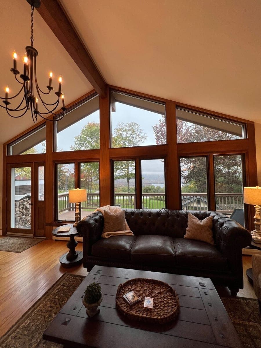 VRBO living room with leather seating and large windows