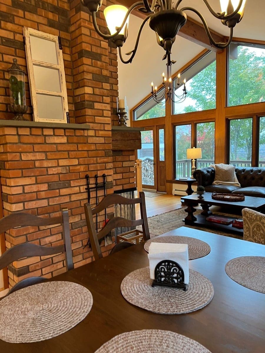 VRBO dining area beside the brick fireplace