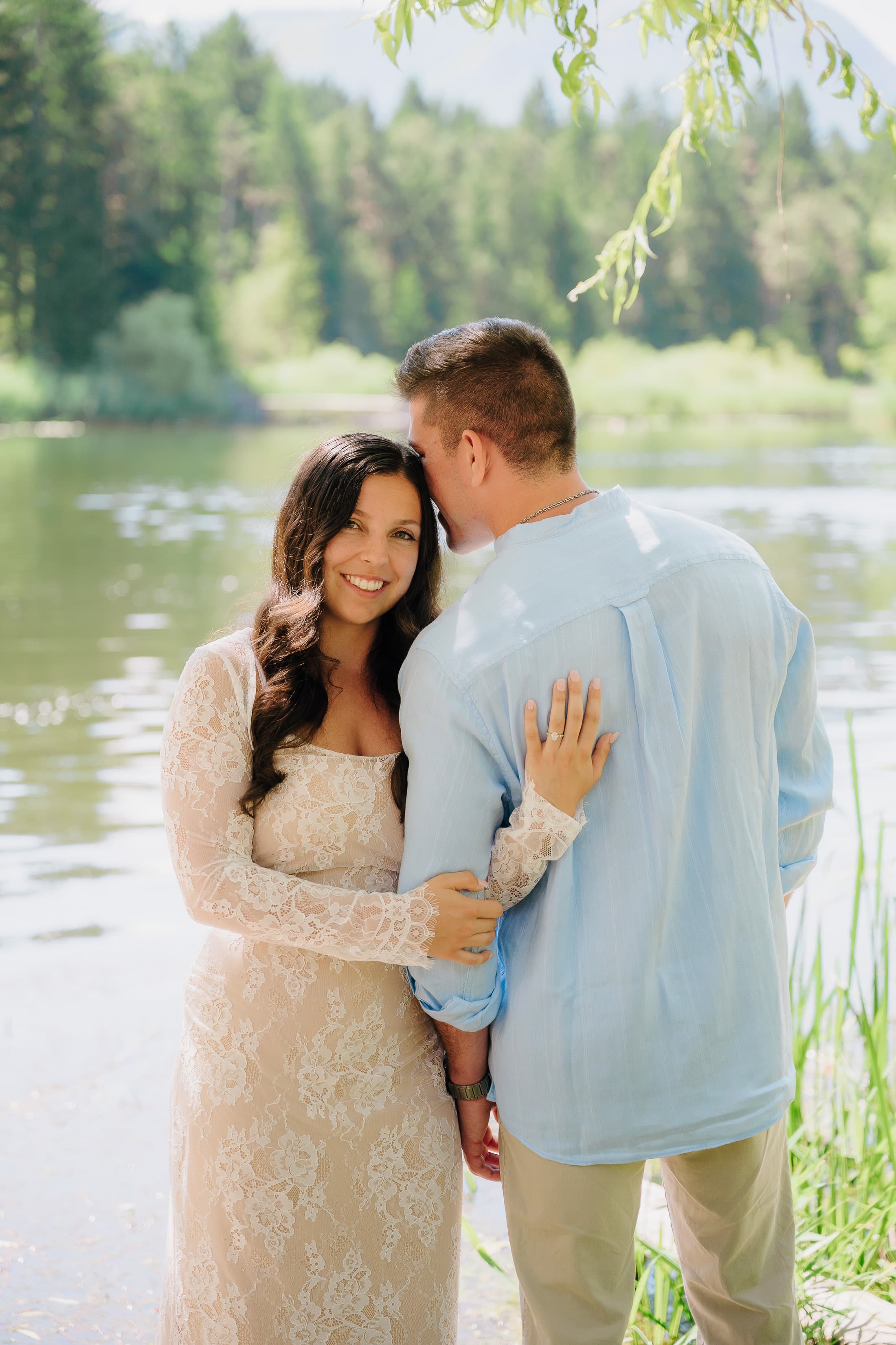 JT and Nicole smiling by the water.