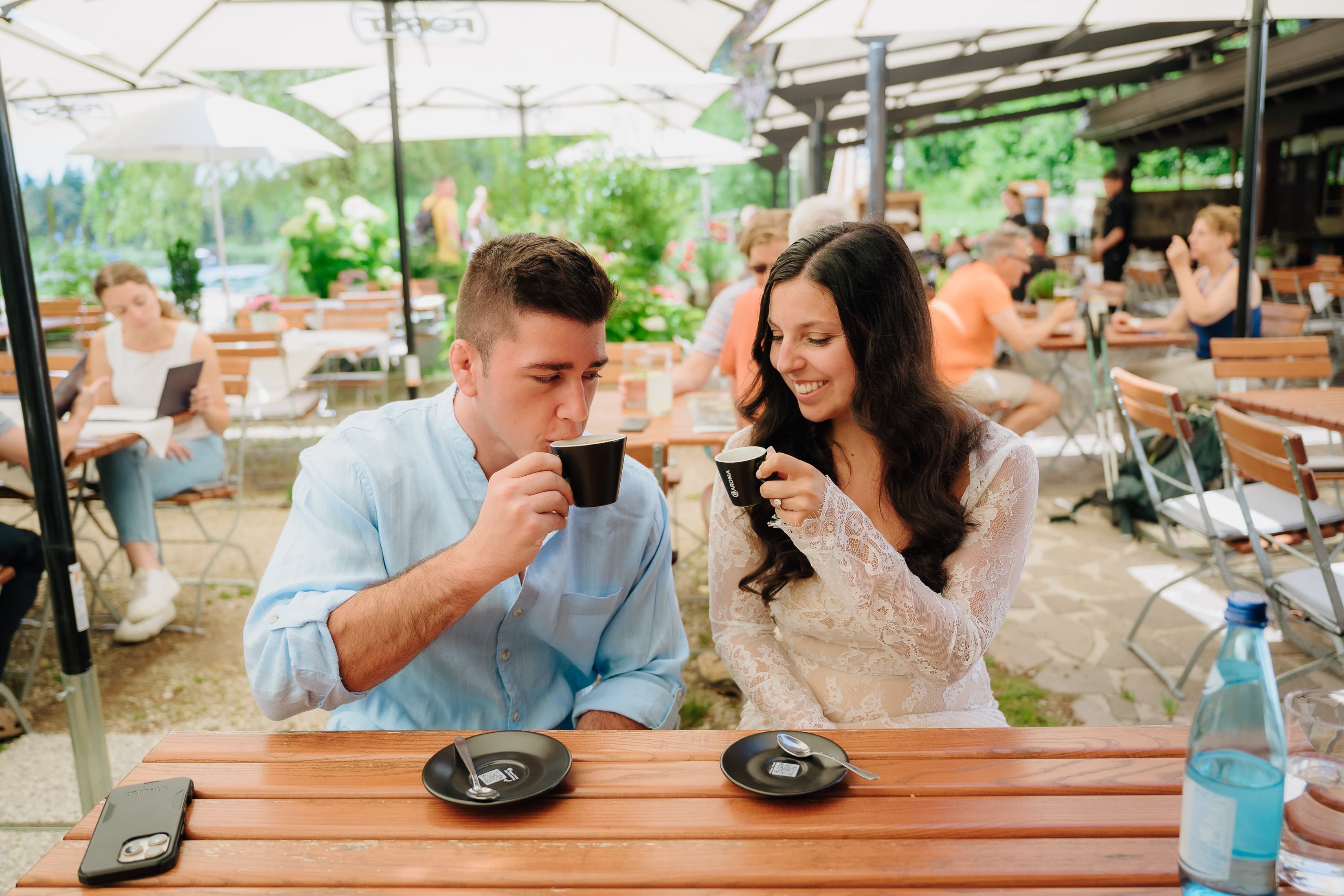 JT and Nicole sitting together at an outdoor table.