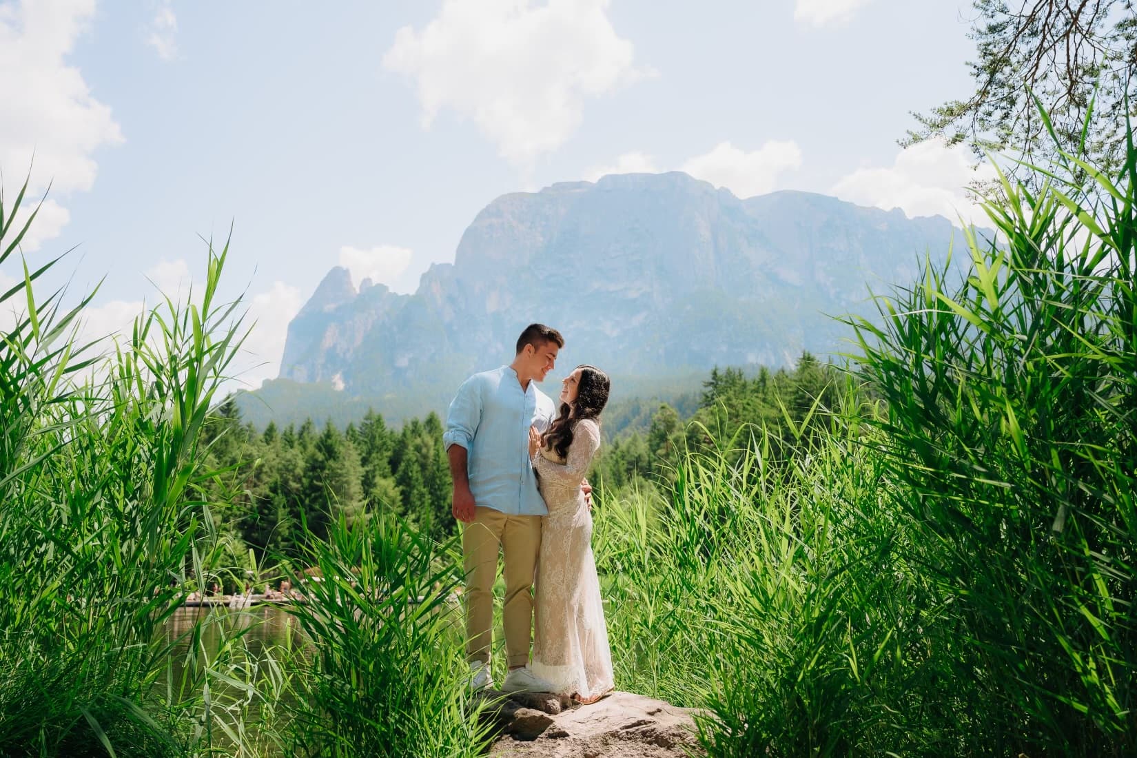 JT and Nicole embracing in front of the mountains.