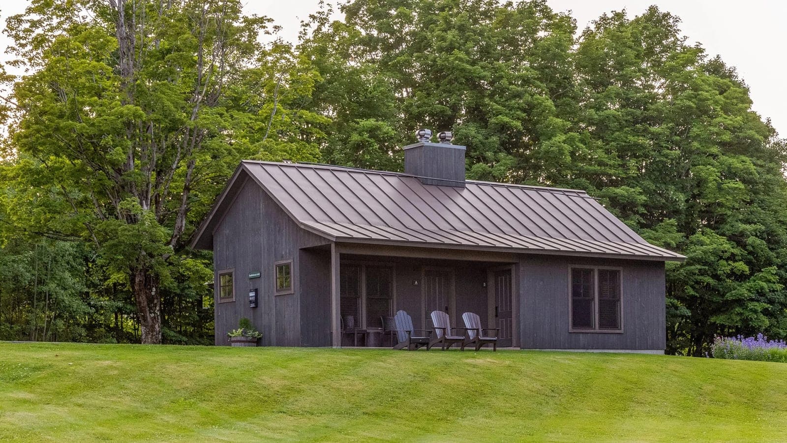 Cabins exterior — full row visible from the main road